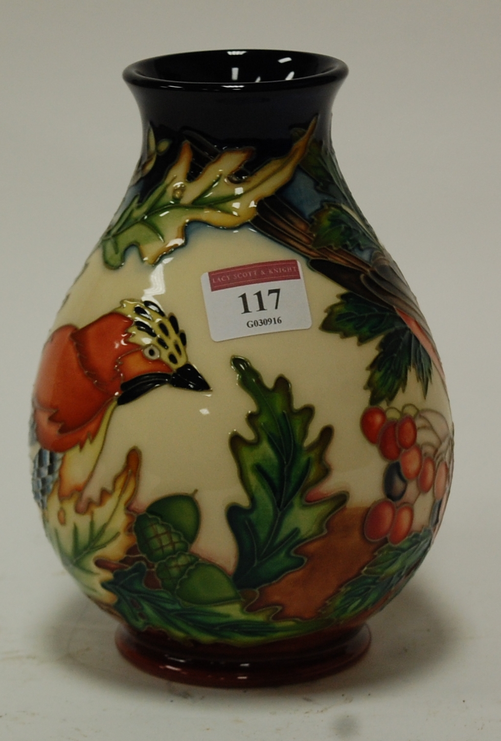 A modern Moorcroft vase in the Inglewood pattern designed by Philip Gibson,