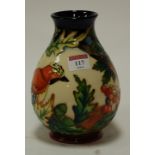 A modern Moorcroft vase in the Inglewood pattern designed by Philip Gibson,