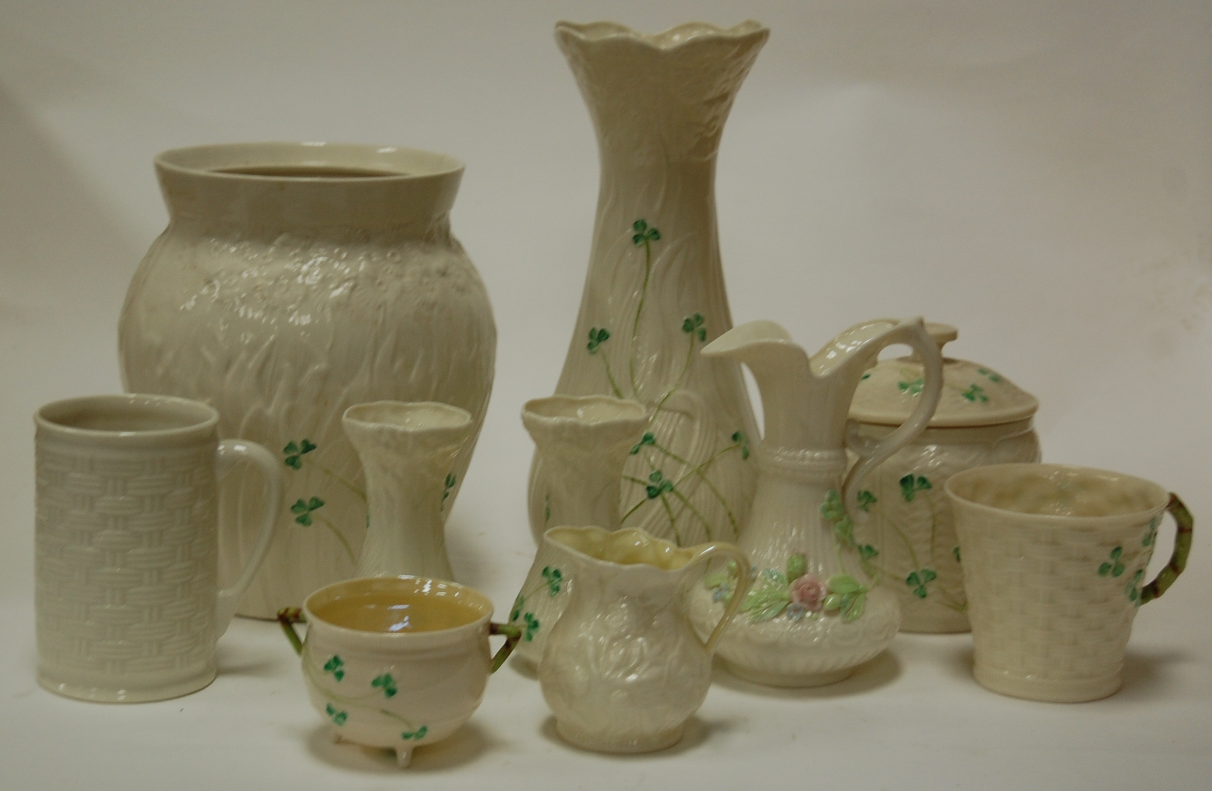 A collection of modern belleek items to include tankard, vases, jar and cover,