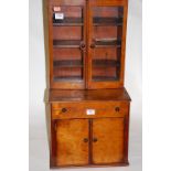 An early 20th century walnut apprentice cabinet in the form of a secretaire bookcase