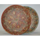 A pair of Watcombe pottery chargers, each with all-over sgraffito decoration, incised 6925 verso,