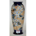 A Royal Doulton stoneware vase, of baluster form, on a blue ground with floral decoration,
