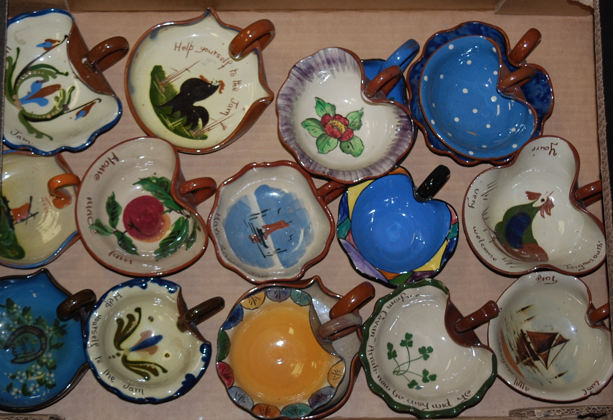 Three boxes of assorted Torquay pottery preserve dishes,