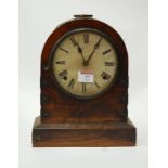 A Victorian walnut gilt metal mounted mantel clock having a paper covered dial with Roman numerals