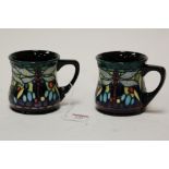A pair of modern Moorcroft mugs in the Dragonfly pattern, impressed mark verso dated 2000, height 8.
