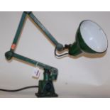 A green painted industrial anglepoise style lamp
