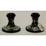 A pair of modern Moorcroft dwarf candlesticks in the Dragonfly pattern impressed mark verso,
