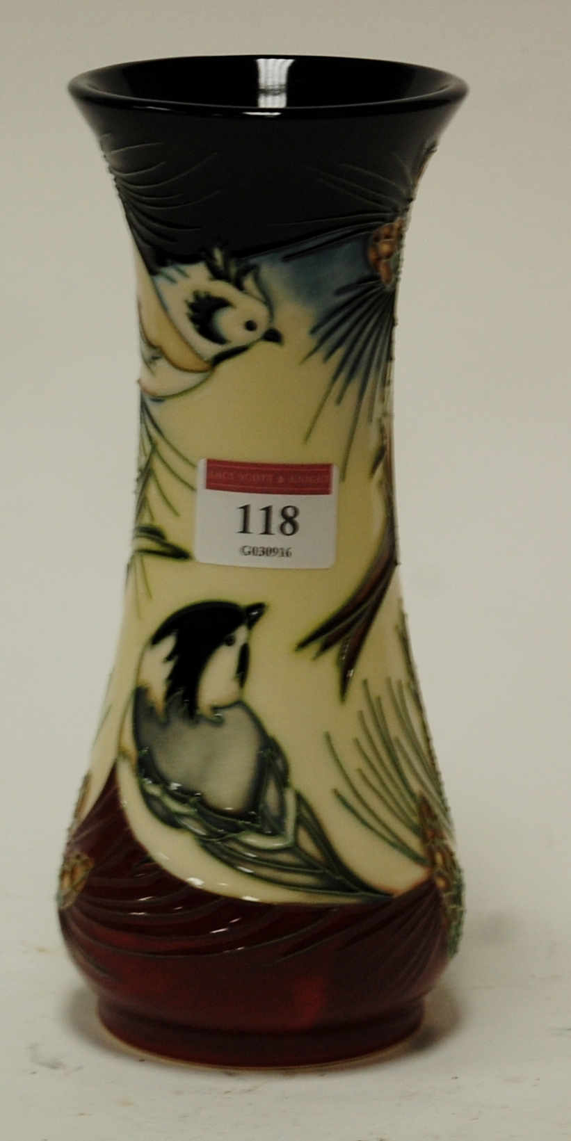 A modern Moorcroft vase in the Inglewood pattern designed by Phillip Gibson,