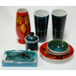 A collection of Poole pottery to include Agean vase, pair of cylindrical vases,