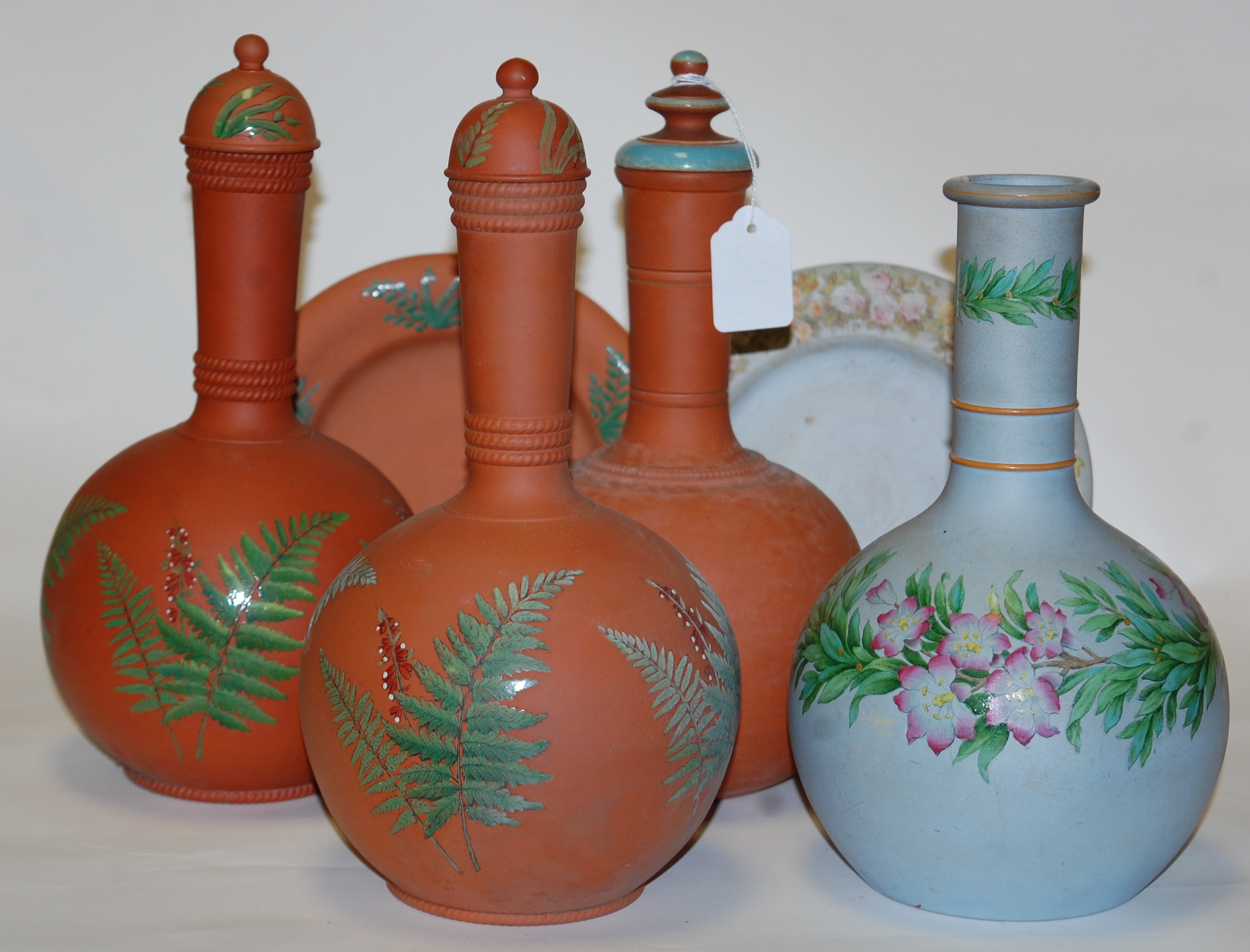 A pair of Victorian Watcombe pottery bottle vases and covers,