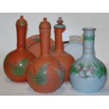 A pair of Victorian Watcombe pottery bottle vases and covers,