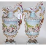 A pair of modern Capo di Monte porcelain ewers, each having all-over cherub and animal decoration,