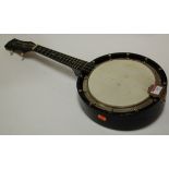 A mid 20th century ebony banjo