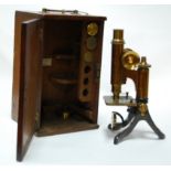 An early 20th century lacquered brass monocular microscope by Henry Crouch of London,