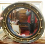 A gilt gesso convex framed wall mirror;