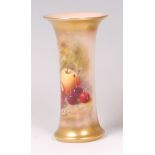 A Royal Worcester porcelain trumpet shaped vase, decorated with fruit on a mossy bank,