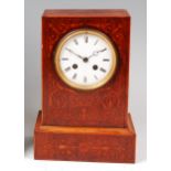 A late 19th century rosewood cased mantel clock, having white enamel dial (with numerous hairlines),