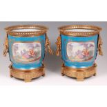A pair of circa 1900 Sevres style porcelain ice pails,