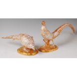 A pair of Vista Alegre of Portugal porcelain figures of a cock and hen golden pheasants,