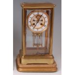 A circa 1900 French lacquered brass four glass mantel clock,