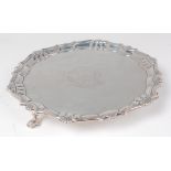 A George II silver card waiter, having a shall cast raised piecrust rim, engraved armorial,