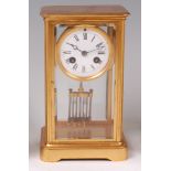 A circa 1900 lacquered brass cased mantel clock,