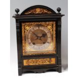 A late Victorian ebonised cased mantel clock, the silvered dial signed Boxell of Brighton,