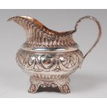 A mid-19th century silver cream jug, of squat circular form,