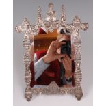 A late 19th century continental white metal easel dressing table mirror,