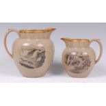 A pair of Victorian earthenware 'bat print' graduated jugs,