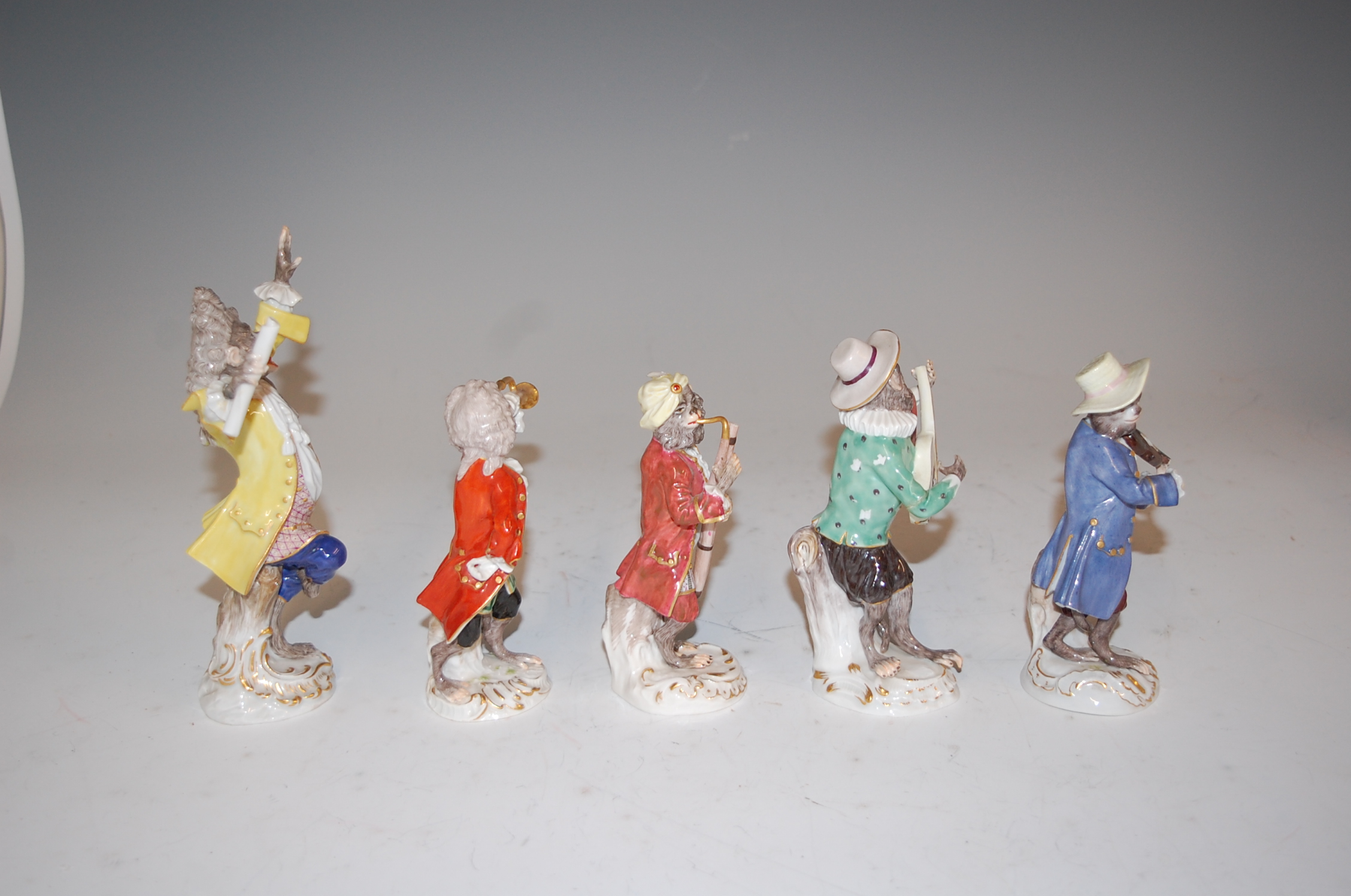 A set of five Meissen porcelain monkey band figures, comprising of the conductor and four musicians, - Image 7 of 8