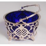 A George V silver bonbon basket, having blue glass liner, gadrooned rim,