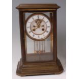 A late 19th century lacquered brass four glass mantel clock,