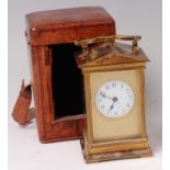 A circa 1900 French lacquered brass carriage clock, having an architectural case,