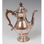 A silver pedestal coffee pot, in the early 18th century style, of pear shape,