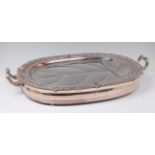 A Victorian silver plated warming meat dish, having twin end carry handles,