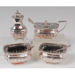 A 19th century white metal four piece cruet set,