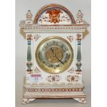 A 19th century Longwy Pottery mantel clock, having a circular brass dial with Roman numerals,