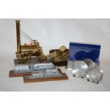 A small brass model of Stephenson's Rocket,