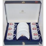 A modern Royal Worcester six place setting coffee service, with floral decoration,