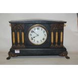 An early 20th century ebonised cased mantel clock, of architectural form,