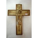 A wooden framed cross depicting the crucifixion of Christ