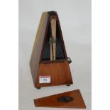 A mid-20th century French walnut cased metronome