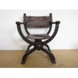 A 19th Century hide-upholstered oak X-frame armchair