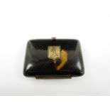 A Victorian tortoiseshell purse, with pique decoration surrounding a gilt metal shield shaped