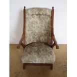 A Victorian upholstered walnut easy armchair