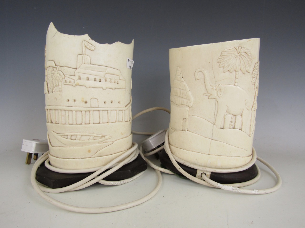 A matched pair of 1920s African elephant tusk ivory table lamps, converted from vases, carved in - Image 2 of 2