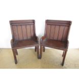 A pair of Victorian ecclesiastical deal armchairs