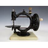 A R. M. Wanzer & Co The Little Wanzer manual sewing machine, black lacquered and gilt, mounted on