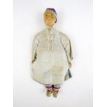 An early 20th Century Chinese doll, with carved wooden head and silk costume, 22 cm